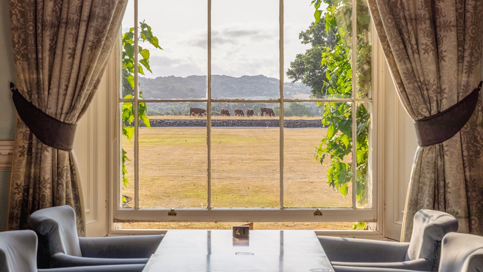 The Blue room is another elegant space where guests can enjoy stunning views of the Herefordshire countryside - complete with grazing cows.