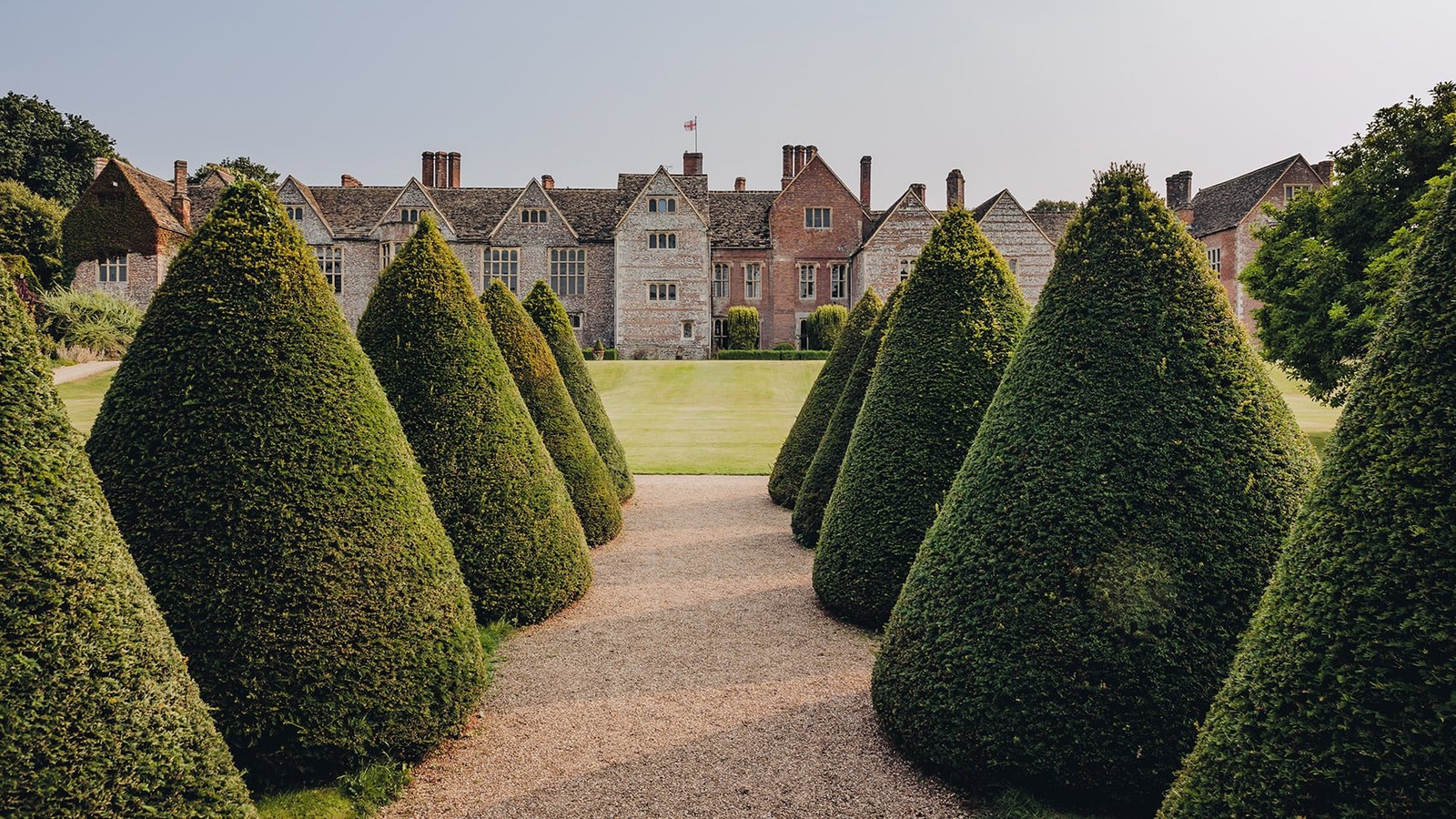 The gardens at Littlecote House are grand, with winding paths and sculpted shrubs that invite exploration.