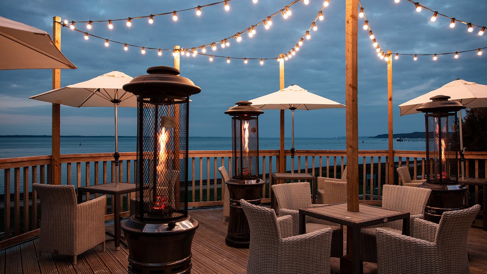 Cosy, warm, and inviting - enjoy a drink on the deck under the glow of fairy lights and the comfort of patio heaters.