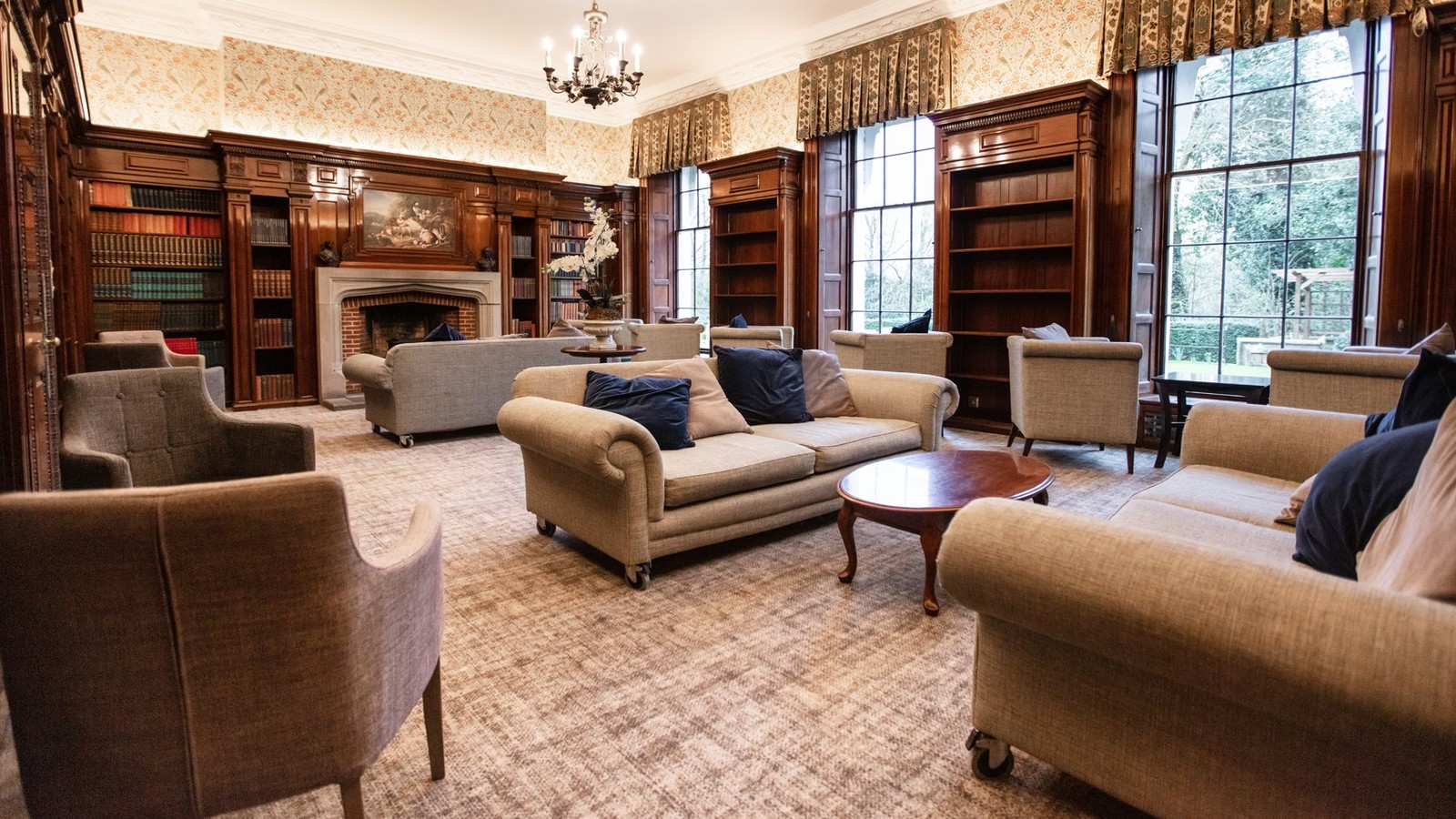 Step into the Library at Nidd Hall, where cosy seating and a tranquil atmosphere invite you to unwind with a book or simply relax.