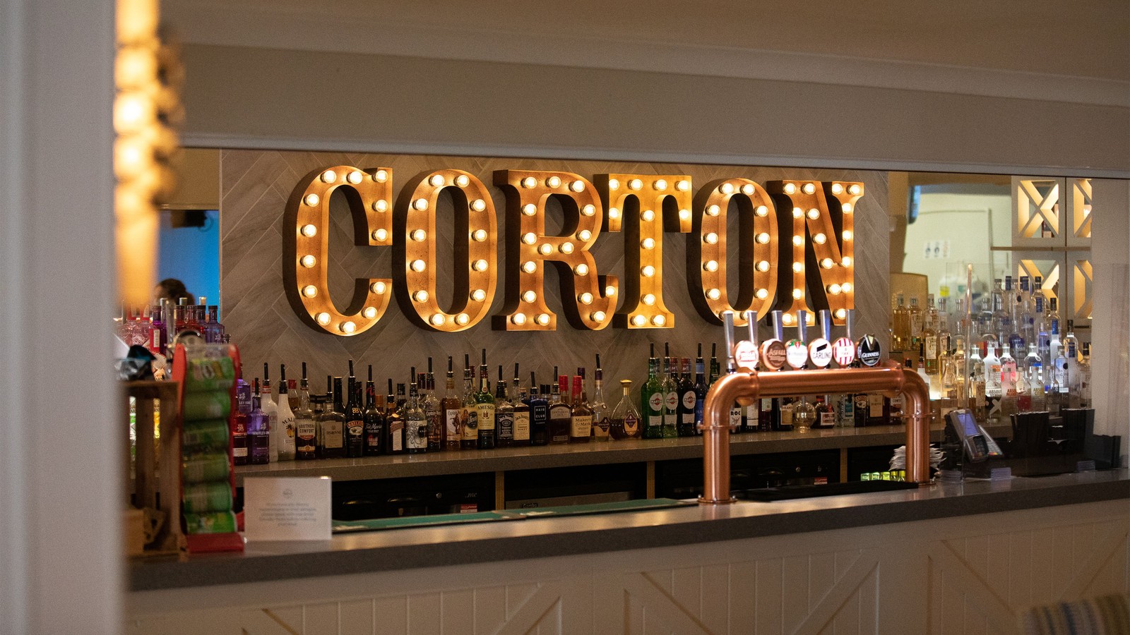 From classic cocktails to a selection of beers, wines and spirits, pick your favourite tipple, then relax, laugh, and enjoy time together under the warm glow of our iconic light-up sign.