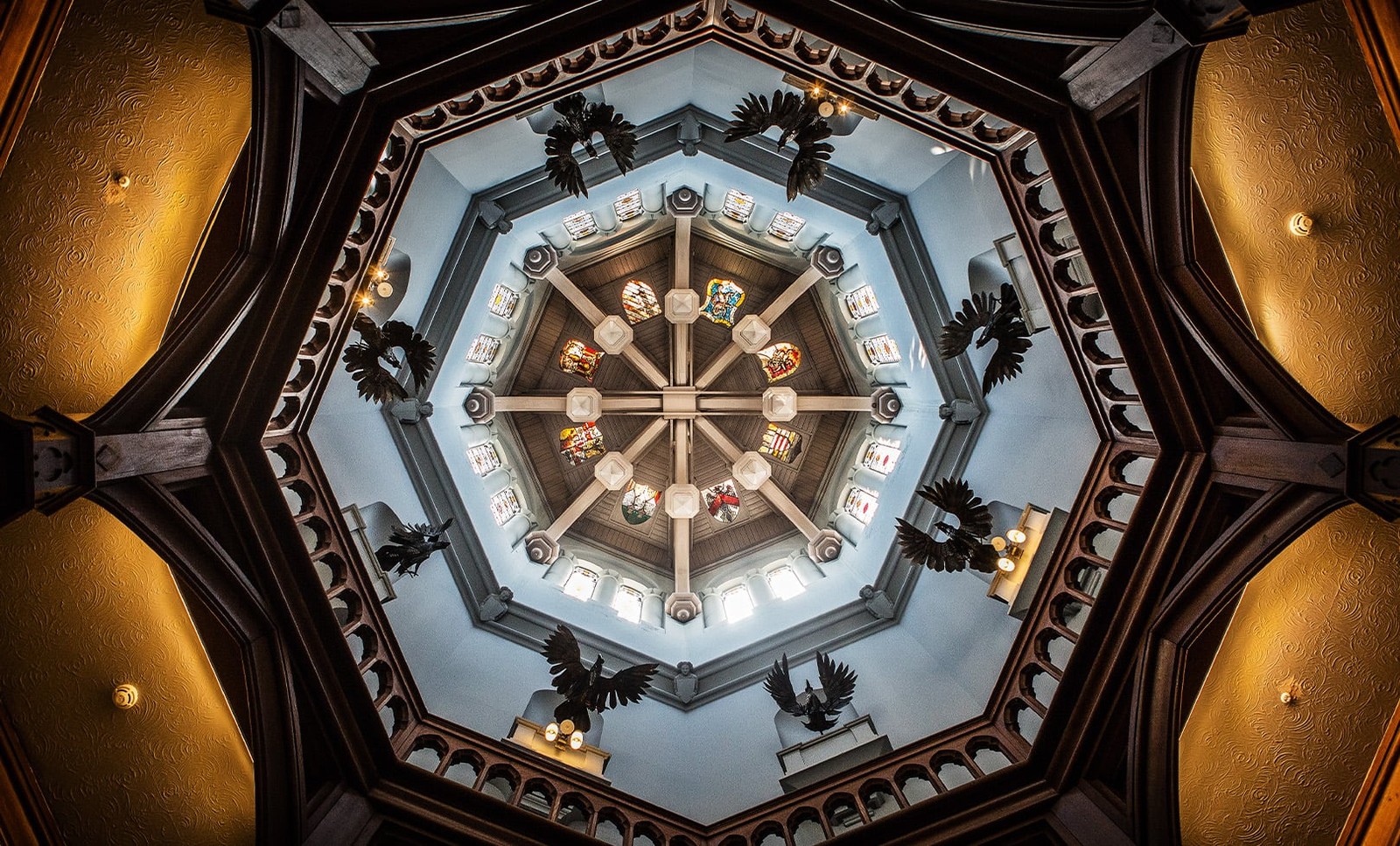Step into Studley Castle’s main entrance and gaze up at the breathtaking circular ceiling, where intricate stained glass, dramatic statues and perfect symmetry create a truly unforgettable first impression.