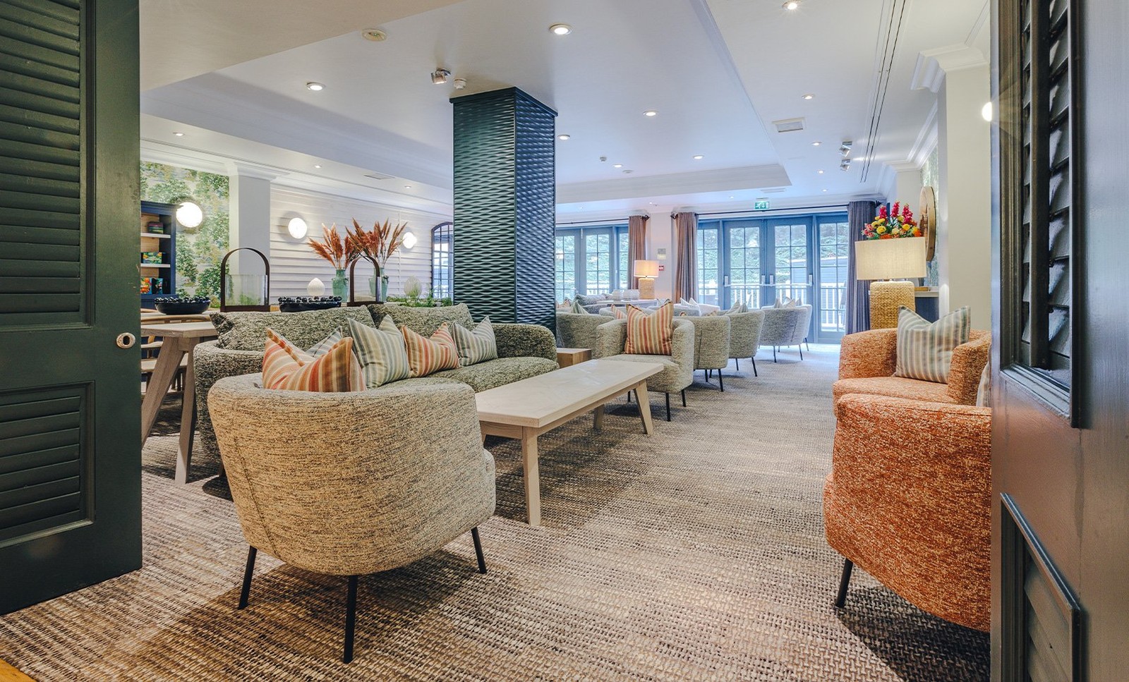 The inviting Garden Room lounge set beside The Spa is a welcoming space for well-being.