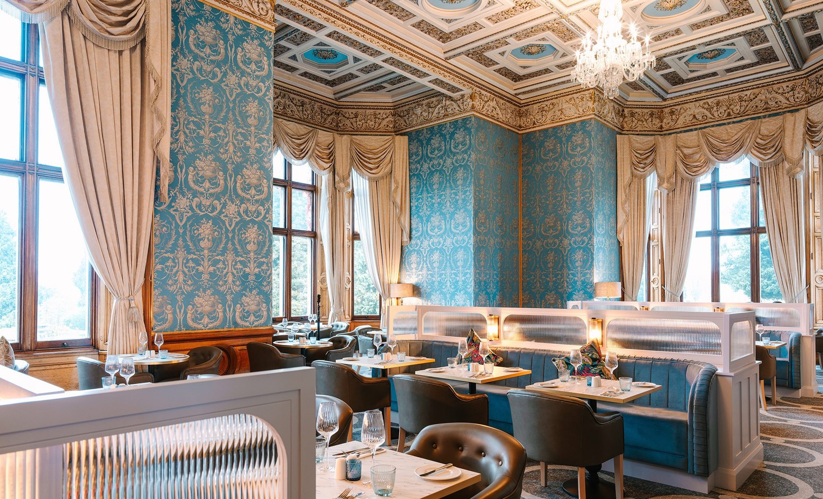 Step into The Blue Room, where elegance meets modern dining in a beautifully designed setting.