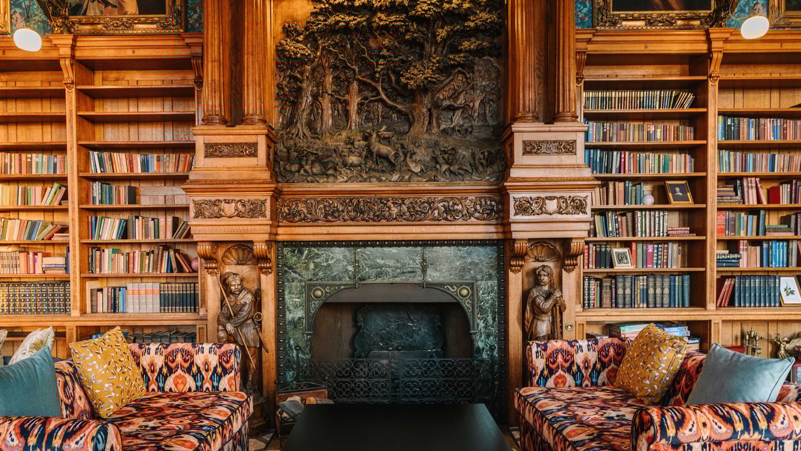 Lose yourself in the calm of this grand library, where walls of books invite quiet reflection.