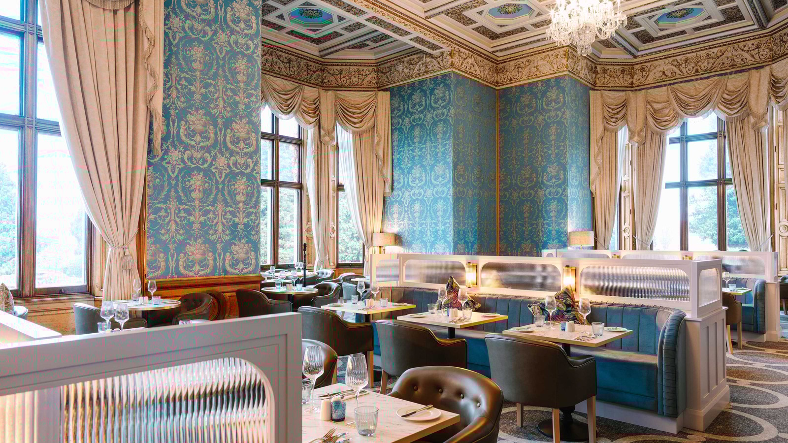 Savour every bite in the elegant Blue Room at Brasserie32 - a space designed to delight, from the table to the intricate ceiling above.