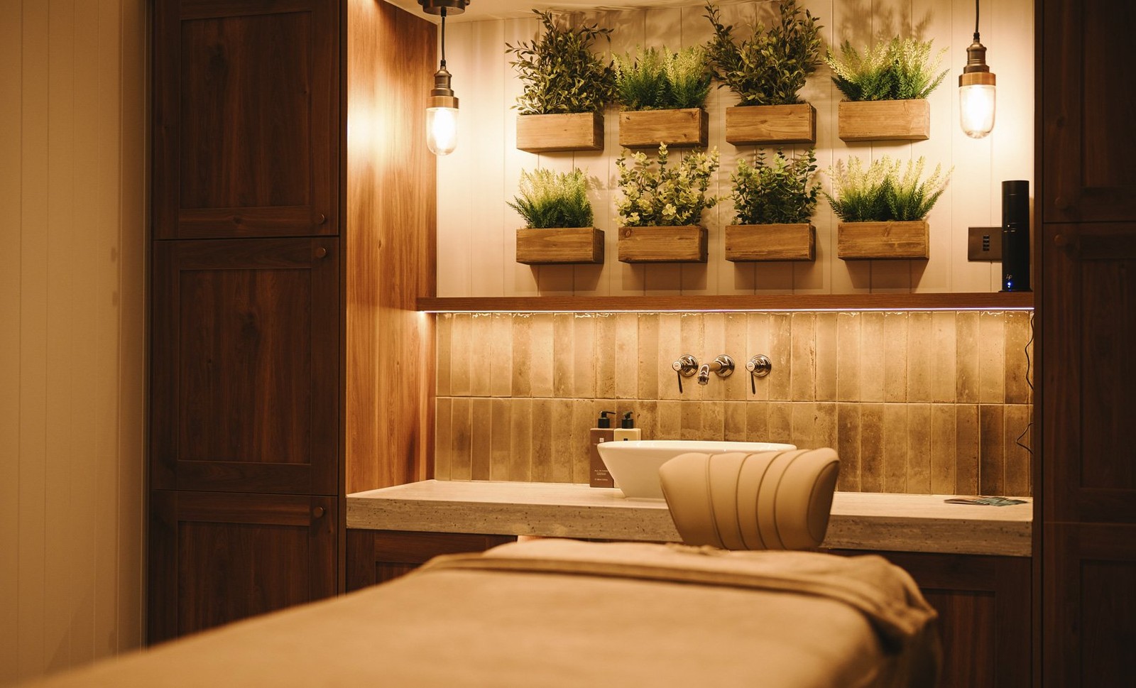 A serene spa treatment room, bathed in soft light, promising relaxation and rejuvenation.