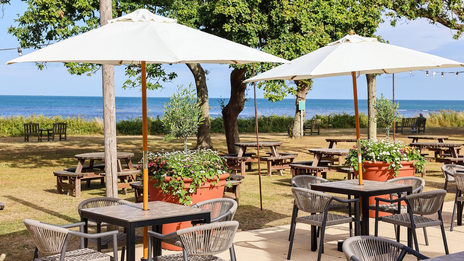 Relax on the terrace with a drink in hand, friends by your side, and the sparkling sea as your backdrop.