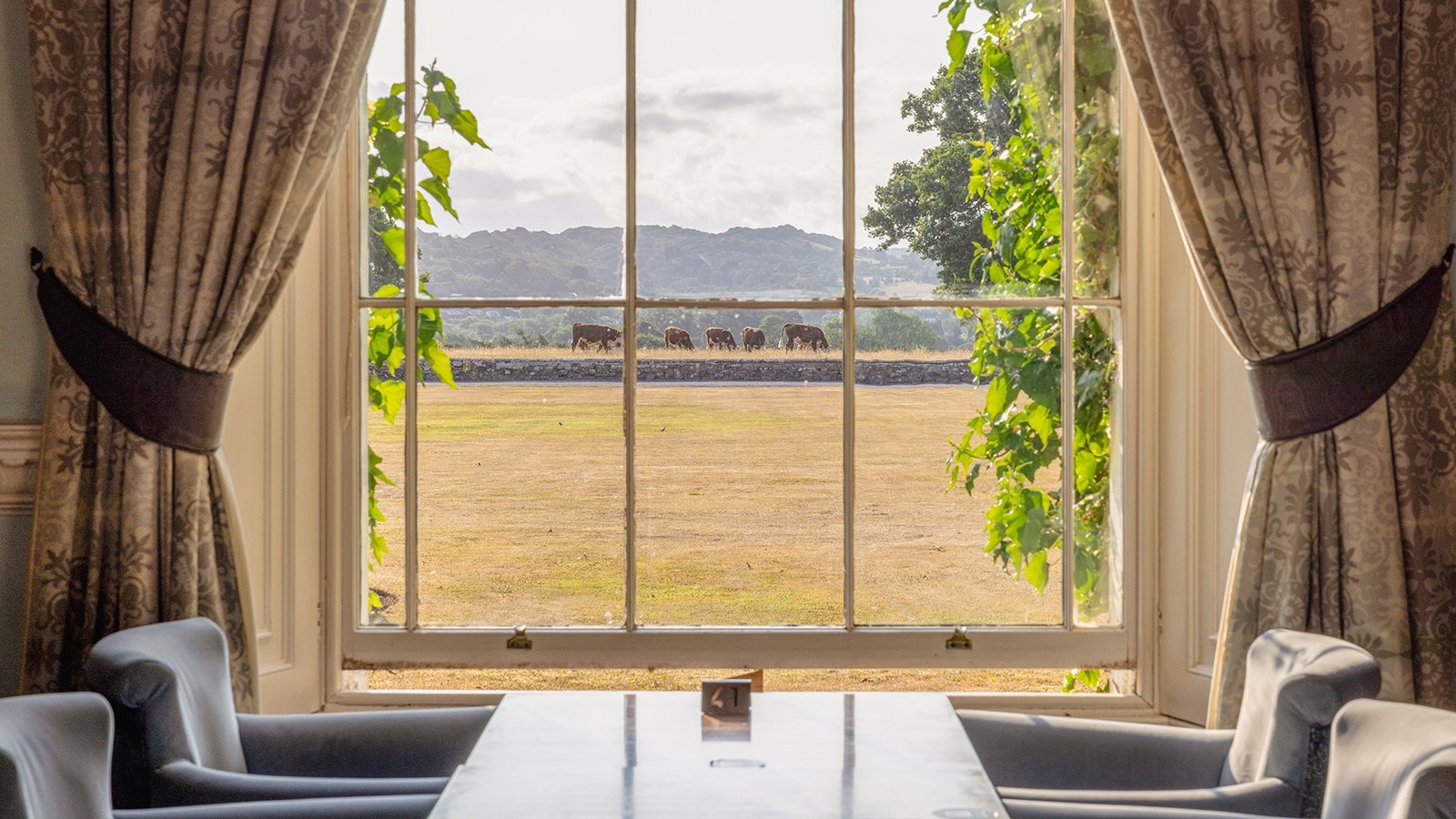 The Blue room is another elegant space where guests can enjoy stunning views of the Herefordshire countryside - complete with grazing cows.