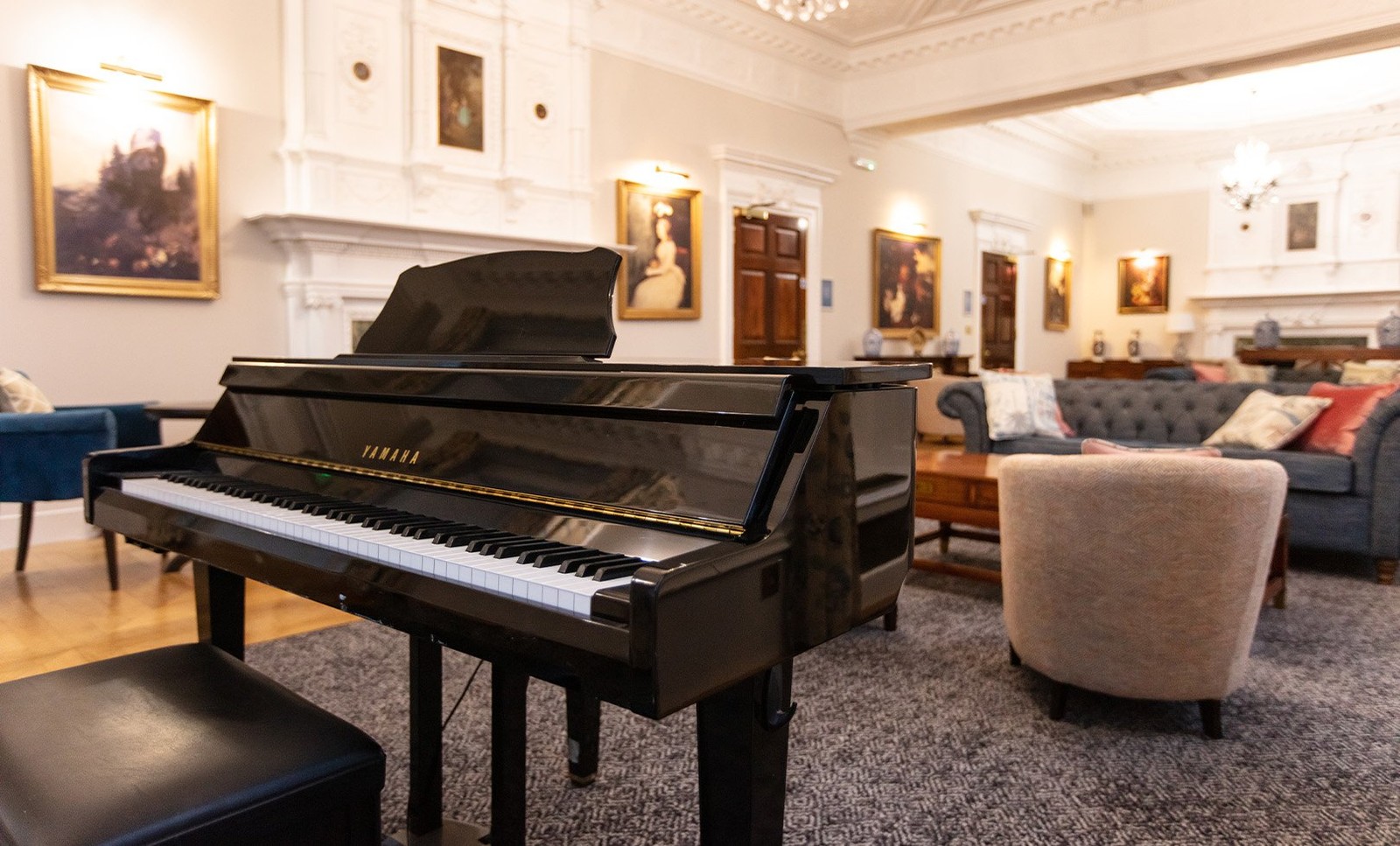 The drawing room is a perfect place to relax and unwind, often filled with the delightful sounds of piano music.