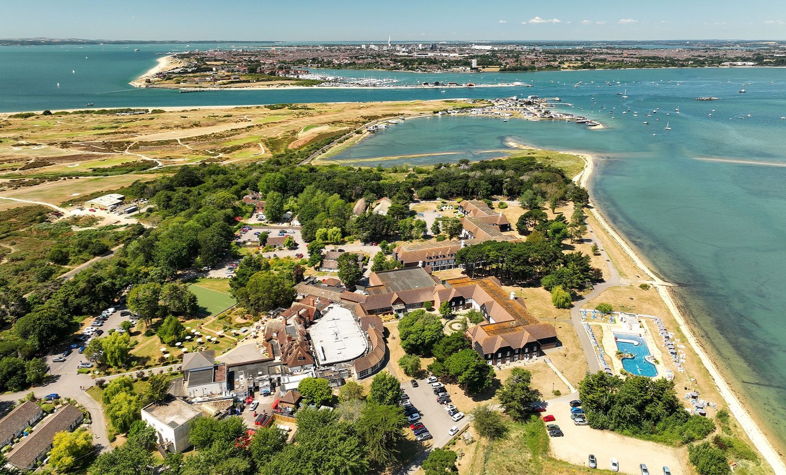 Who needs a postcard when you have this? This stunning aerial view of Sinah Warren showcases lush greenery and sparkling waters, just waiting to be explored during your stay.