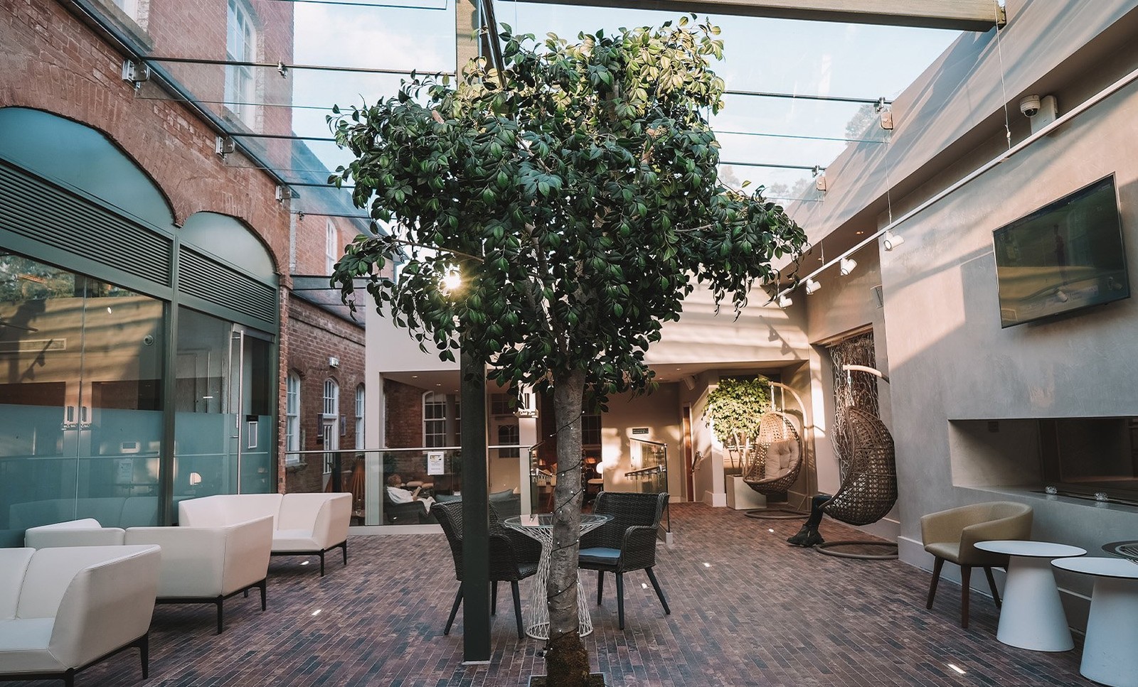 Step into the spa and feel relaxed from the moment you arrive. Set in a courtyard-style orangery with a glorious tree at its centre, the reception invites you to unwind before your treatment.