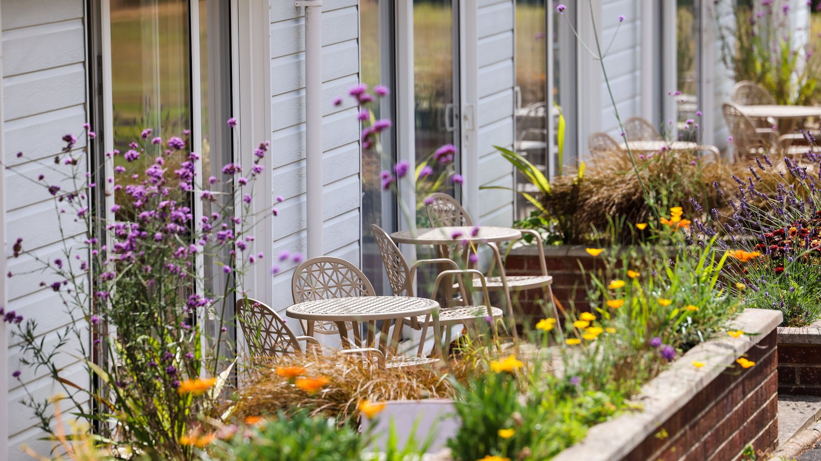 The Garden Suites are highly sought after - patios, comfy seating, and a backdrop of vibrant flowers make them simply irresistible.