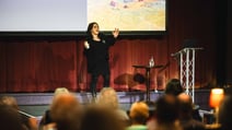 Lady speaker presenting at conference during BBC History Magazine Weekend.