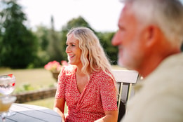 Guests enjoying drinks on the terrace in the sun