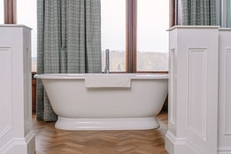 Bath on a raised platform inside a Manor House Suite at Thoresby Hall