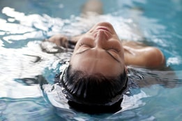 Woman swimming in pool
