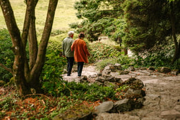 Couple holding hands discovering the grounds at Cricket st. Thomas
