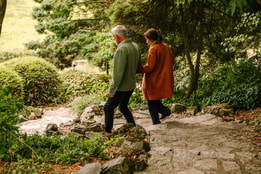 Two guests wandering through the grounds of Cricket St. Thomas