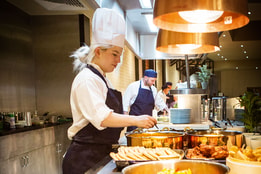 Chef at the buffet preparing food