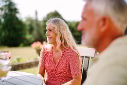 Guests having drinks on the terrace at Cricket St. Thomas