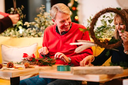 Guests creating their own christmas wreaths