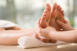 Person's feet being massaged