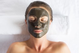 Woman with a face mask applied