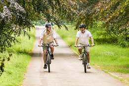 Two guests cycling on the grounds at Heythrop Park