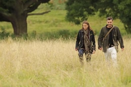 Couple walking in a meadow