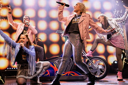 Cast of Rock of Stages, a Warner Theatre Company live production, on stage at Heythrop Park, a Warner Hotel