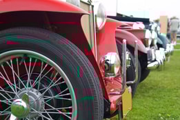 Close up of a wheel on a vintage car