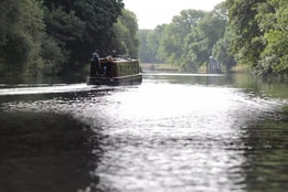 A boat sailing along The River Thames