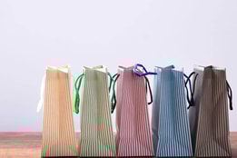 Colourful striped paper shopping bags
