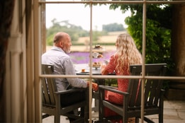 Couple enjoying afternoon tea at Cricket St. Thomas