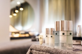 Temple Spa toiletries on a bed