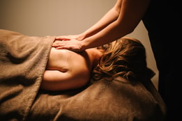 getting a back massage with towels
