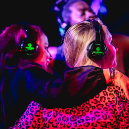 Guests enjoying silent disco at a Warner Hotel