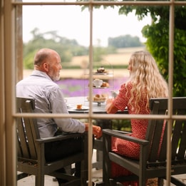 Couple enjoying afternoon tea at Cricket St. Thomas