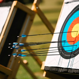 Archery board with arrows in