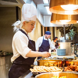 Chef at the buffet preparing food