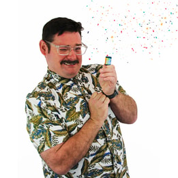 David Arnold pulling a party popper and colourful confetti appearing