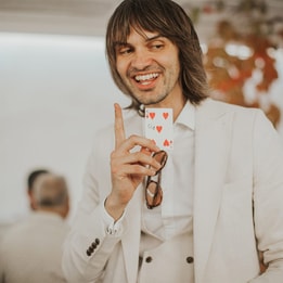pete heat in a white suit