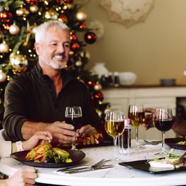 Guests toasting as they celebrate Christmas together at a Warner Hotel