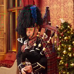 A piper playing the bagpipes