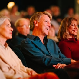 Guests watching a string quartet by candle light