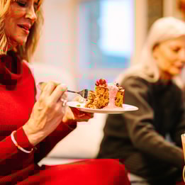 Close up of a guest enjoying a delicious festive treat from the Coffee Nest