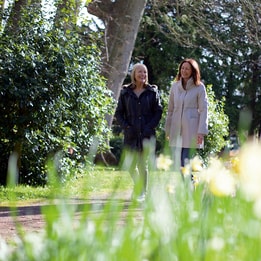 A couple of guests wandering through the grounds at Holme Lacy House