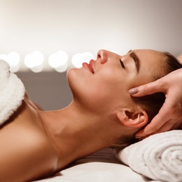 Woman receiving a head massage