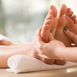 Person's feet being massaged